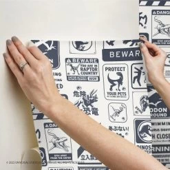 Jurassic World Dominion Signs Peel And Stick Wallpaper Tan/Blue - RoomMates -Child Furniture Store GUEST 9bebc459 3c57 4555 b27b e4e156778ae1